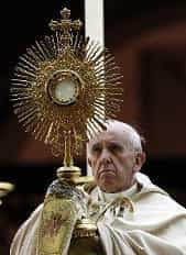 Pope Francis holding monstrance | sun worship symbols
